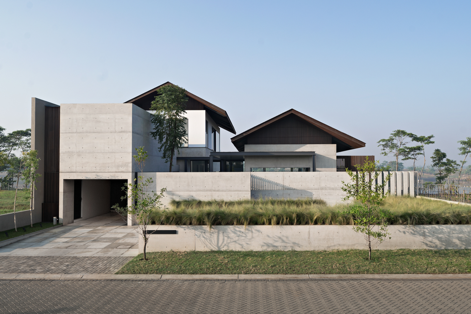Bare concrete house with Japanese style roof