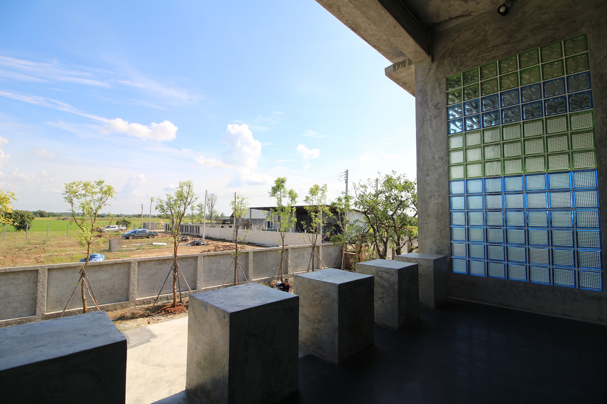 Concrete house on stilts with rural vibe